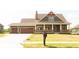 Charming craftsman-style home with a two-car garage, inviting front porch, and well-manicured lawn at 0 Goat Hollow Lot 4, Martinsville, IN 46151