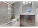 Bathroom with a tiled shower, dark vanity and dark framed mirror at 1074 Timber Creek Dr # 8, Carmel, IN 46032