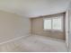Neutral bedroom with a view of the outdoor area and closet door on the right at 1074 Timber Creek Dr # 8, Carmel, IN 46032