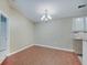 Dining room area featuring modern chandelier lighting, hardwood flooring and next to the kitchen at 1074 Timber Creek Dr # 8, Carmel, IN 46032