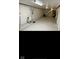Spacious basement with white painted walls and flooring featuring mechanical components and ample room for various uses at 1101 E 25Th St, Muncie, IN 47302