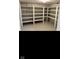 Organized storage space in a well-lit basement, featuring extensive shelving units for efficient storage solutions at 1101 E 25Th St, Muncie, IN 47302