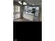 Bright kitchen with white cabinets, granite countertops, stainless steel appliances and adjacent dining area at 1101 E 25Th St, Muncie, IN 47302