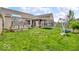 Spacious backyard with playground set, swing set, and trampoline provides ample space for outdoor activities at 11254 N Sashing Way, Monrovia, IN 46157