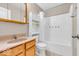 Well-lit bathroom featuring a shower-tub combo, wooden vanity, and tiled floor at 11254 N Sashing Way, Monrovia, IN 46157