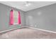 Comfortable bedroom with soft carpet, and a bright window dressed with pink curtains at 11254 N Sashing Way, Monrovia, IN 46157