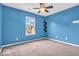 Bright bedroom with a large window and neutral carpeting for comfortable living at 11254 N Sashing Way, Monrovia, IN 46157