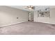 Spacious living room with neutral walls and plush carpeting, perfect for entertaining and relaxing at 11254 N Sashing Way, Monrovia, IN 46157