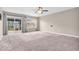 Open living room with sliding glass doors leading to the patio, offering easy outdoor access at 11254 N Sashing Way, Monrovia, IN 46157