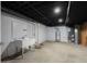 Unfinished basement with utility sink, water heater, and updated HVAC system, ready for customization at 1127 Junco Dr, Columbus, IN 47203