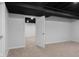 Finished basement featuring neutral carpet, recessed lighting, and door open to another room at 1127 Junco Dr, Columbus, IN 47203