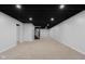 Finished basement featuring recessed lighting, neutral carpet, and stairs leading to upper level at 1127 Junco Dr, Columbus, IN 47203