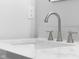 Close up on the dual sink with white countertop and silver fixtures at 1127 Junco Dr, Columbus, IN 47203