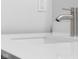 Bathroom faucet featuring modern design and a white quartz countertop at 1127 Junco Dr, Columbus, IN 47203