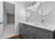 Bathroom showcasing dual sinks, vanity, and a view into an adjoining bedroom at 1127 Junco Dr, Columbus, IN 47203