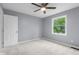 Bright bedroom with a ceiling fan and window offering natural light at 1127 Junco Dr, Columbus, IN 47203