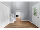 Foyer showing wood-look flooring, gray walls, closet and showing a view of the fireplace at 1127 Junco Dr, Columbus, IN 47203
