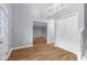 Open foyer with light-gray walls, wood-look flooring, and a coat closet at 1127 Junco Dr, Columbus, IN 47203