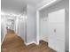 Hallway featuring hardwood floors and closet, providing access to other rooms at 1127 Junco Dr, Columbus, IN 47203