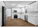 Modern eat-in kitchen features bright white cabinets, stainless appliances, and subway tile backsplash at 1127 Junco Dr, Columbus, IN 47203