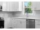 This stunning kitchen features stainless appliances and beautiful white cabinets at 1127 Junco Dr, Columbus, IN 47203