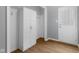 Functional mud room area with storage cabinets, hooks, and a convenient entryway door at 1127 Junco Dr, Columbus, IN 47203