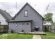 Backyard with green grass, deck and siding at 1201 Villa Ave, Indianapolis, IN 46203