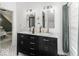 Bathroom features a double vanity with marble countertop and black cabinets below for ample storage at 1201 Villa Ave, Indianapolis, IN 46203