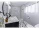 Charming bathroom with subway tile, hexagonal tile flooring and marble countertops at 1201 Villa Ave, Indianapolis, IN 46203