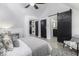 Light bedroom has a large window and doors to a dressing room and bathroom, providing lots of privacy at 1201 Villa Ave, Indianapolis, IN 46203