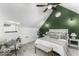 A cozy bedroom with an interesting ceiling, large window, and queen bed at 1201 Villa Ave, Indianapolis, IN 46203