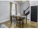 Cozy dining room with hardwood floors, modern lighting, and a stylish table setting at 1201 Villa Ave, Indianapolis, IN 46203