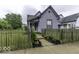 Charming two-story home featuring a well-maintained lawn and inviting walkway at 1201 Villa Ave, Indianapolis, IN 46203