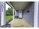 Spacious front porch featuring a wooden deck, stylish columns, and a welcoming entrance at 1201 Villa Ave, Indianapolis, IN 46203