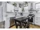 Bright kitchen featuring white cabinets, stainless steel appliances, and modern fixtures at 1201 Villa Ave, Indianapolis, IN 46203