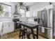 Contemporary kitchen featuring stainless steel appliances, stylish white cabinetry, and an island at 1201 Villa Ave, Indianapolis, IN 46203