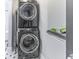 This laundry room features a stacked front load washer and dryer at 1201 Villa Ave, Indianapolis, IN 46203