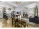 Open living and kitchen space features wood floors, stainless appliances, and ample seating options at 1201 Villa Ave, Indianapolis, IN 46203