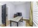 Home office features wood floors, light gray walls, and black painted door at 1201 Villa Ave, Indianapolis, IN 46203