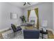 Well-lit office space with elegant curtains, hardwood floors, and a comfortable seating arrangement at 1201 Villa Ave, Indianapolis, IN 46203