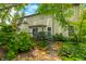 Backyard view of a deck, garden area, and lush foliage, creating a serene outdoor space at 1245 Elm Grove Ln, Greenwood, IN 46143