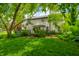Expansive backyard featuring a deck and lush greenery, creating a perfect setting for outdoor entertaining at 1245 Elm Grove Ln, Greenwood, IN 46143
