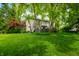 Spacious backyard with mature trees, providing a private and shaded outdoor space at 1245 Elm Grove Ln, Greenwood, IN 46143