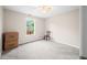 Bedroom with neutral carpet, ceiling fan, a sunlit window, and two boxes on the floor at 1245 Elm Grove Ln, Greenwood, IN 46143
