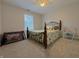 Comfortable bedroom with a queen-sized bed, natural light, and neutral decor at 1245 Elm Grove Ln, Greenwood, IN 46143