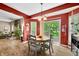 Cozy dining area with a round table and chairs, adjacent to the kitchen and living room at 1245 Elm Grove Ln, Greenwood, IN 46143