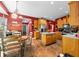 Bright kitchen with stainless steel appliances, wood cabinets, and an island with countertop seating at 1245 Elm Grove Ln, Greenwood, IN 46143