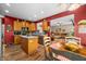 Open kitchen and dining area with wood cabinetry, an island, and seamless flow to living room at 1245 Elm Grove Ln, Greenwood, IN 46143