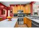 Well-equipped kitchen featuring stainless steel appliances, custom wood cabinets and a speckled tile backsplash at 1245 Elm Grove Ln, Greenwood, IN 46143