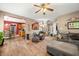 Spacious living room showcasing wood-look floors and access to the kitchen and dining area at 1245 Elm Grove Ln, Greenwood, IN 46143